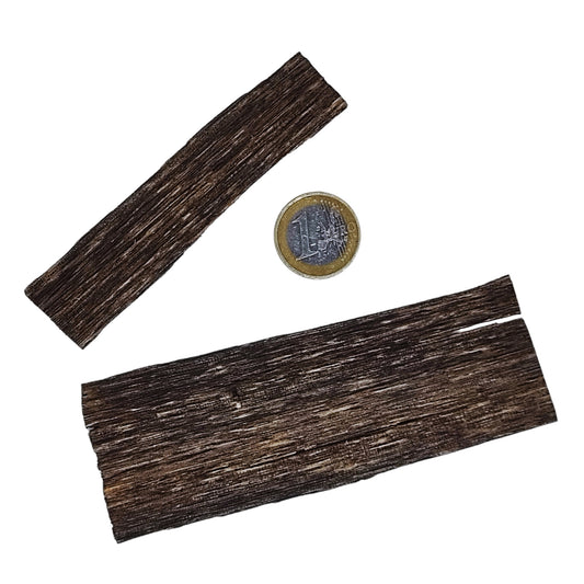 Adlerholz Oud neben Münze